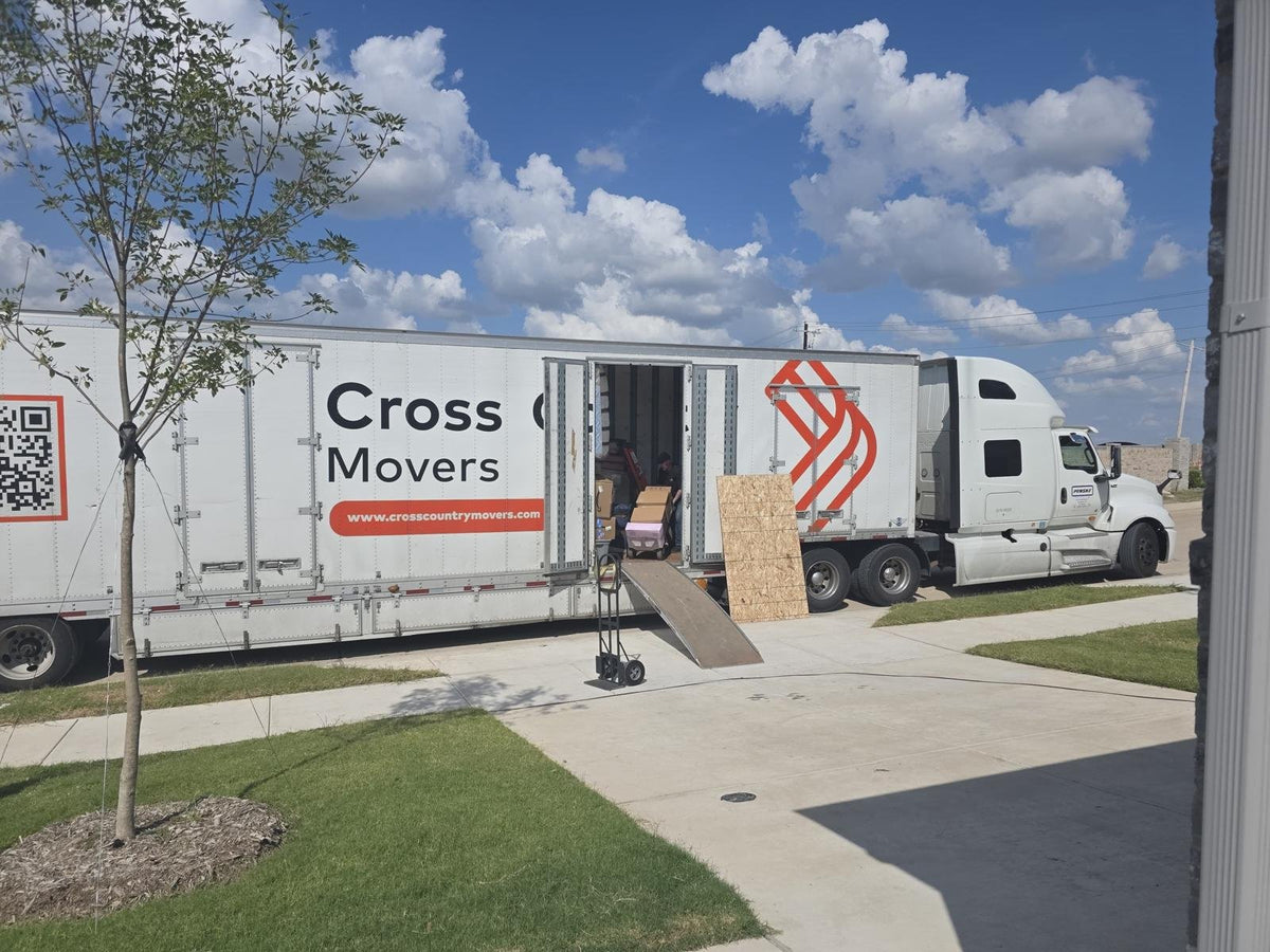 Cross Country Movers truck parked at a home on moving day