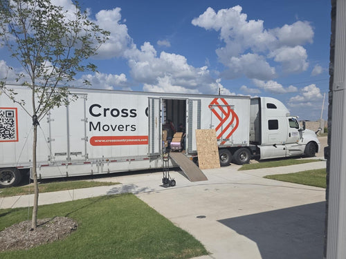 Cross Country Movers truck parked at a home on moving day