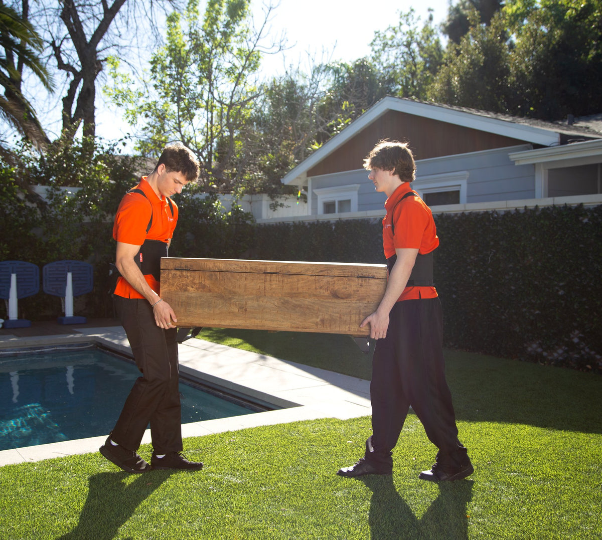 Movers carrying furniture