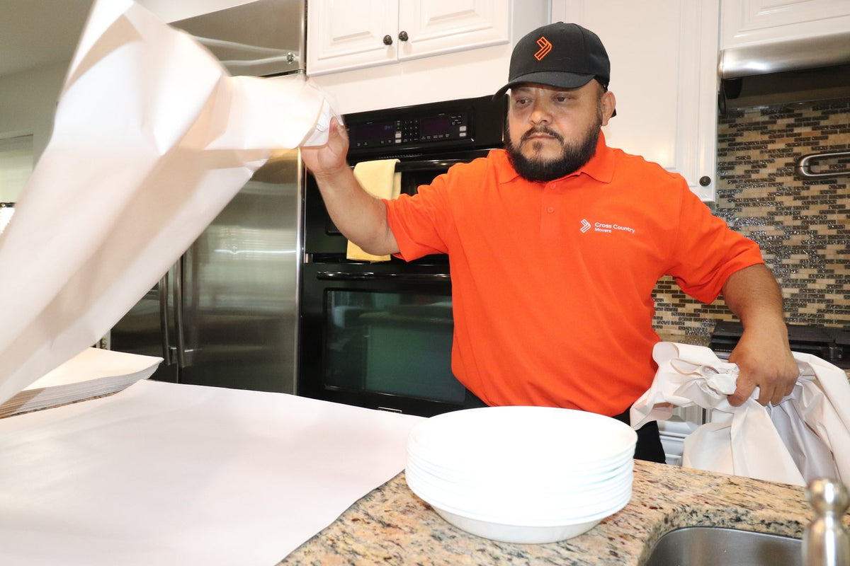Movers packing household items
