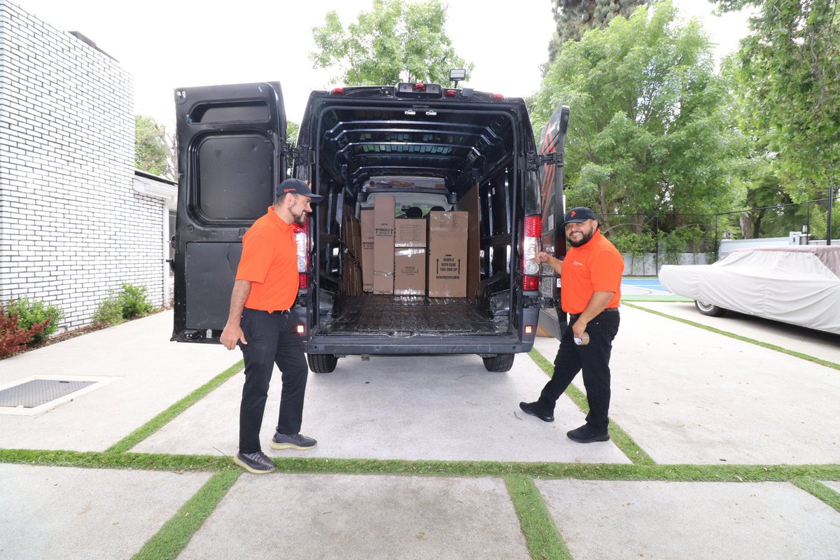 Movers loading a van